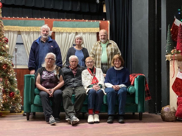 Some of the Technical Chairpeople posing on a Christmas set